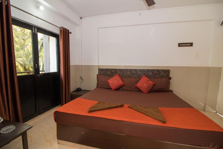Postel nebo postele na pokoji v ubytování Travo Suites Panjim