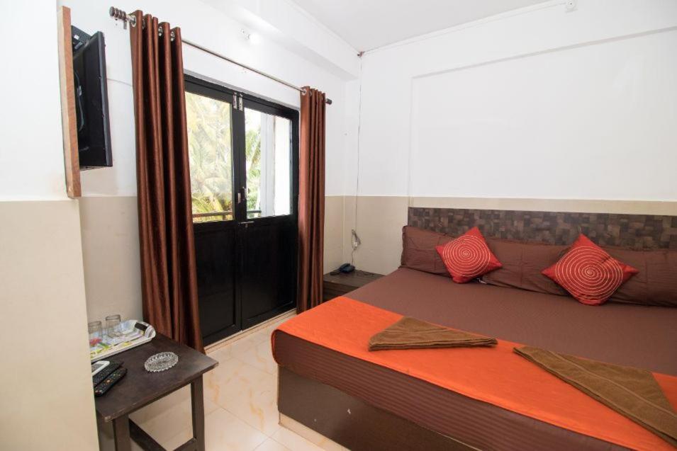 Postel nebo postele na pokoji v ubytování Travo Suites Panjim