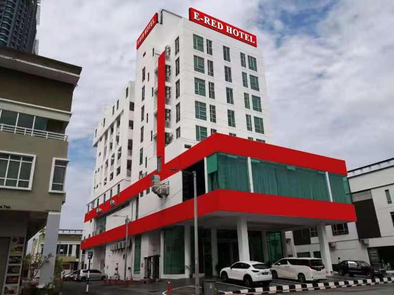 a redford hotel with cars parked in front of it at E-Red Hotel Melaka in Malacca