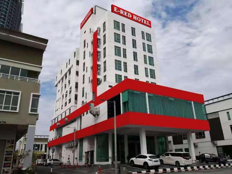 a redford hotel with cars parked in front of it at E-Red Hotel Melaka in Melaka