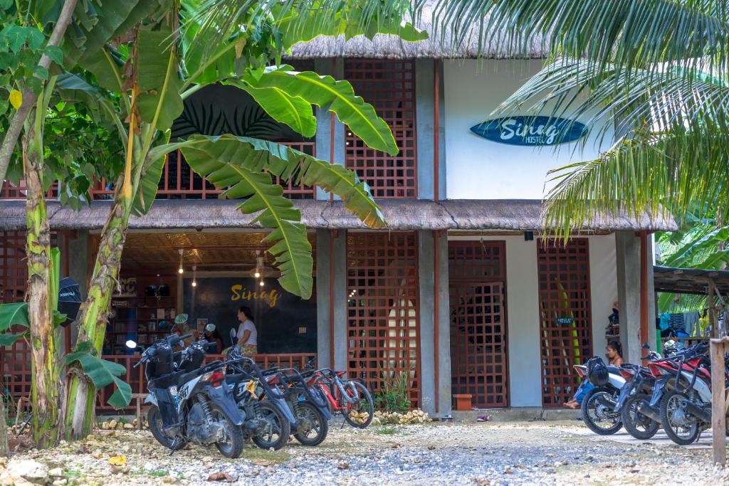 a group of motorcycles parked in front of a store at Sinag Hostel in General Luna