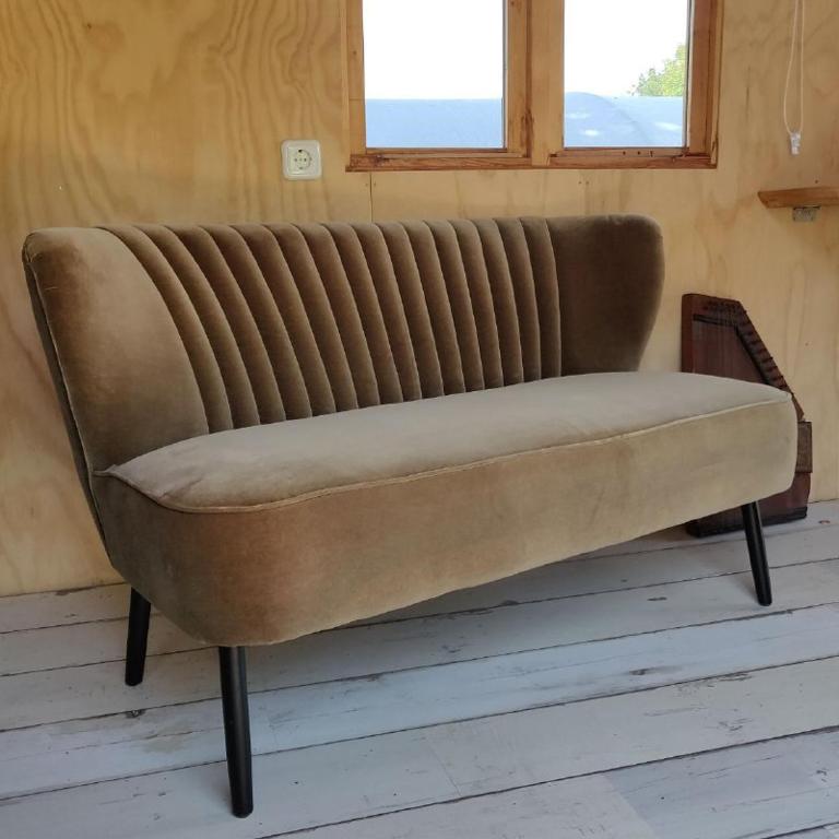 Posezení v ubytování Pipowagen Overnachting Het Houten Huis