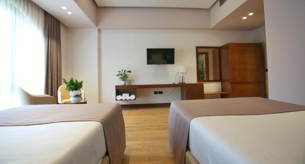 Uma televisão e/ou sistema de entretenimento em Portik Hotel