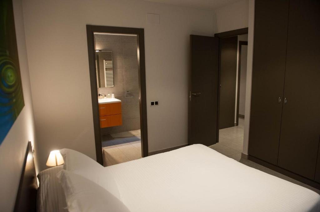 Postel nebo postele na pokoji v ubytování WinTuWin Apartments