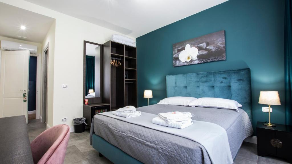 Postel nebo postele na pokoji v ubytování Regolo Rooms Vaticano