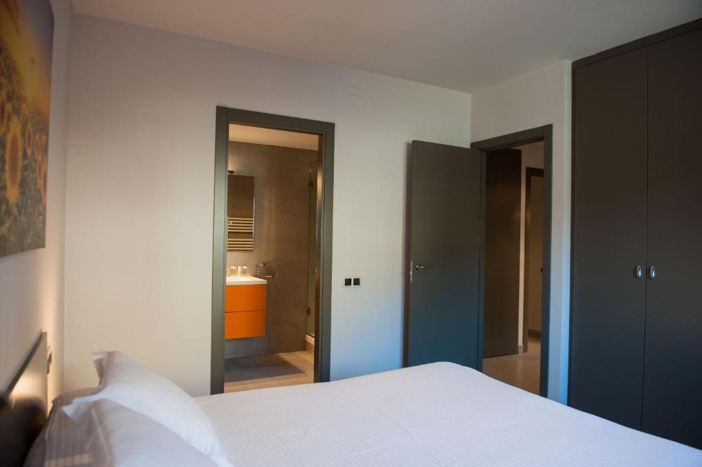 Postel nebo postele na pokoji v ubytování WinTuWin Apartments