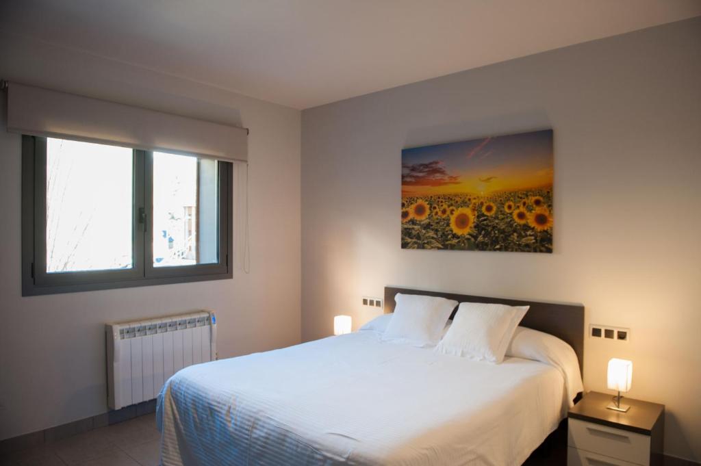 Postel nebo postele na pokoji v ubytování WinTuWin Apartments
