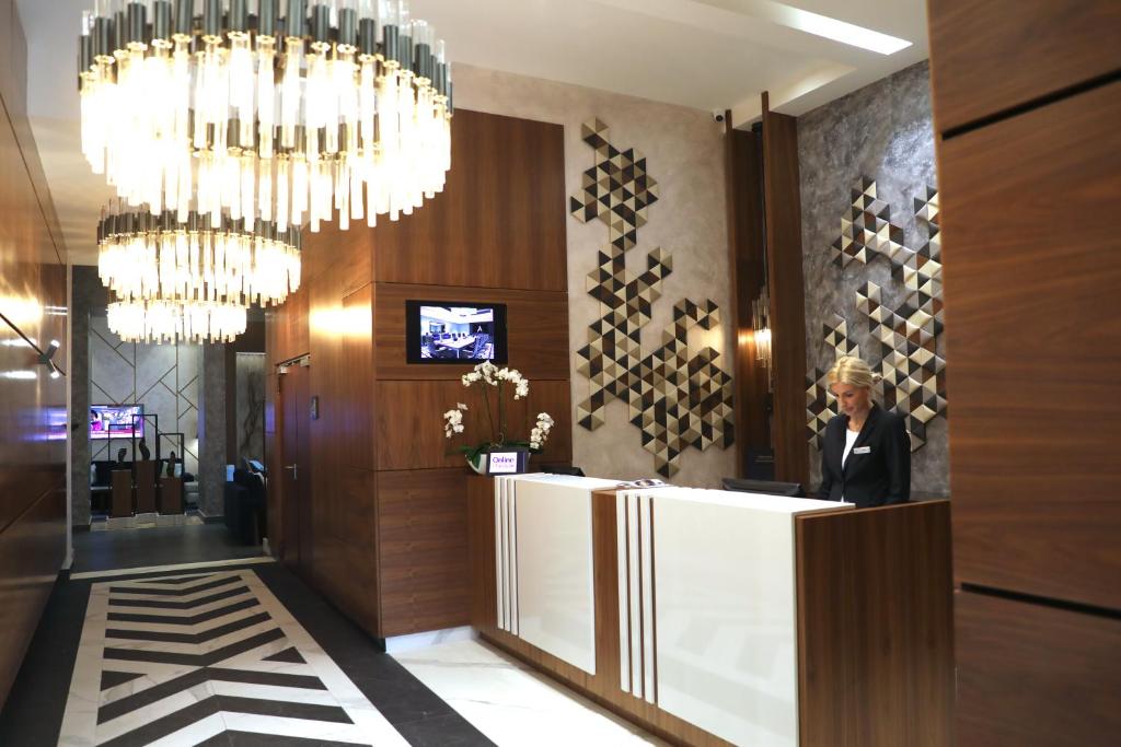 TV a/nebo společenská místnost v ubytování Bosmal Arjaan by Rotana