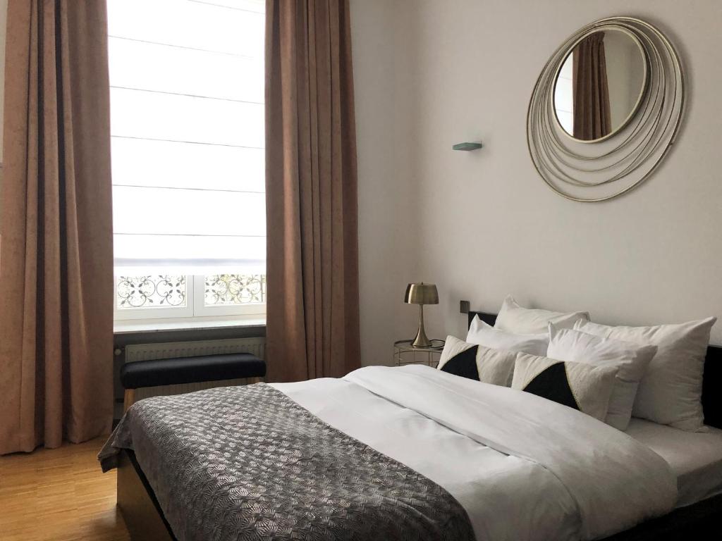 Postel nebo postele na pokoji v ubytování Hotel Vauban