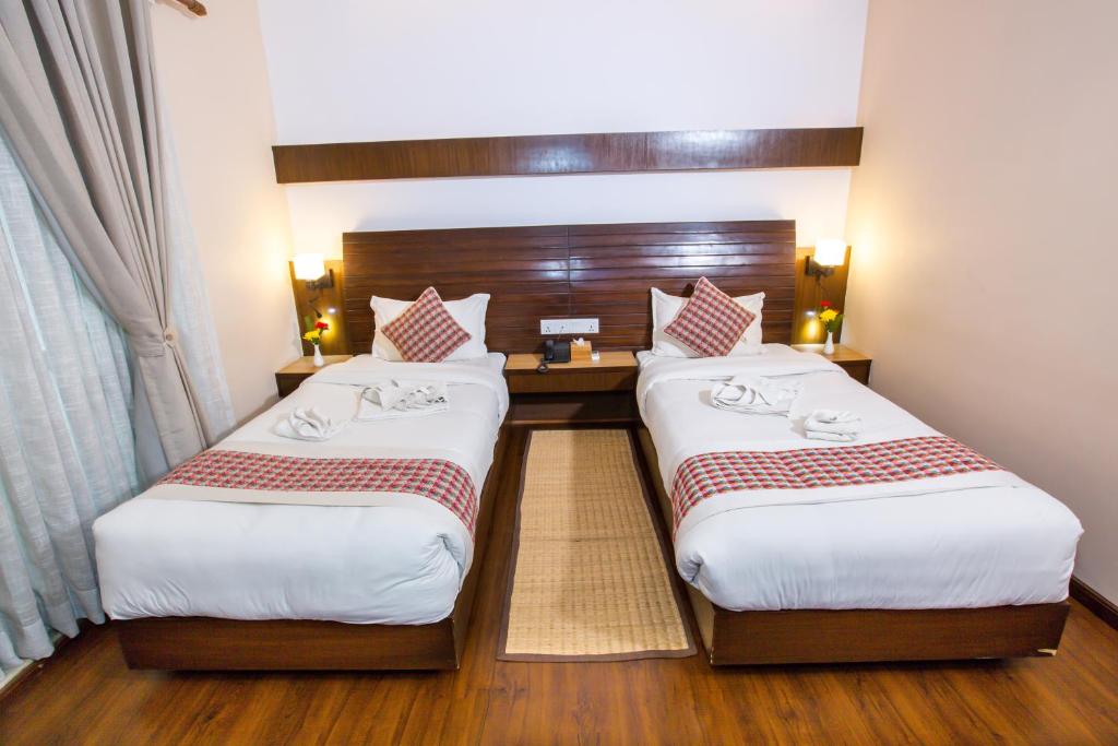 Postel nebo postele na pokoji v ubytování Kathmandu Suite Home