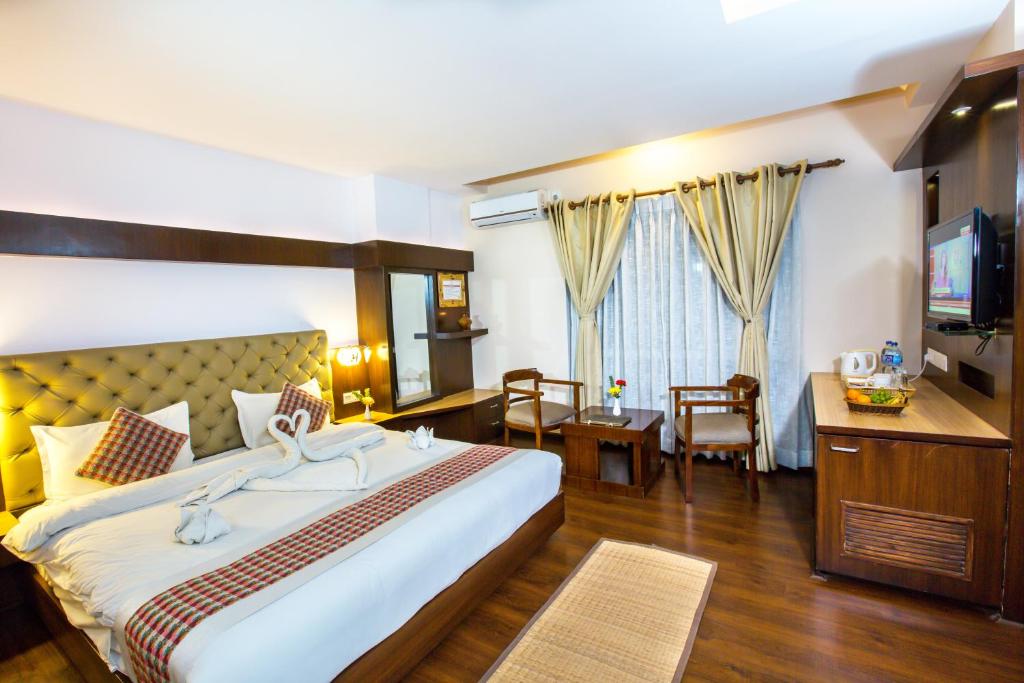 Postel nebo postele na pokoji v ubytování Kathmandu Suite Home