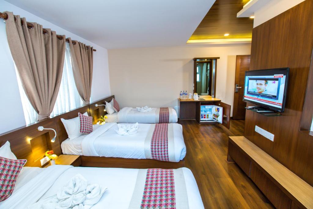 TV a/nebo společenská místnost v ubytování Kathmandu Suite Home