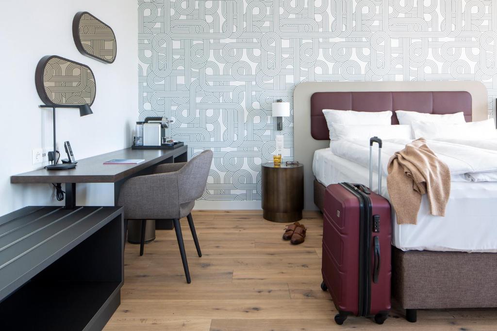 Postel nebo postele na pokoji v ubytování Hotel Walhalla
