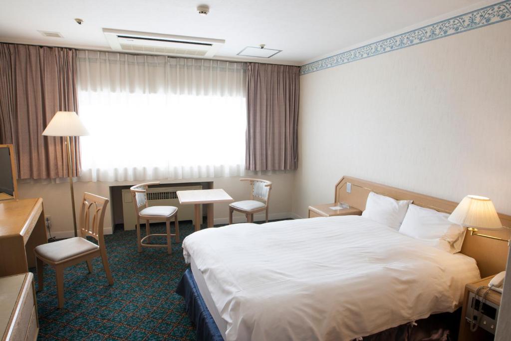 Postel nebo postele na pokoji v ubytování Hotel Mt. Fuji