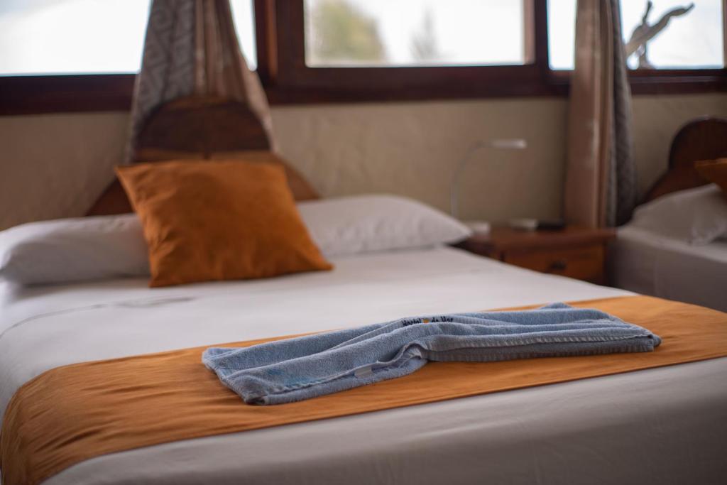 Postel nebo postele na pokoji v ubytování Hostal Estrella de Mar