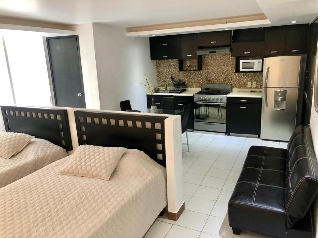 Nhà bếp/bếp nhỏ tại Hotel y suites acapulco mediterrane