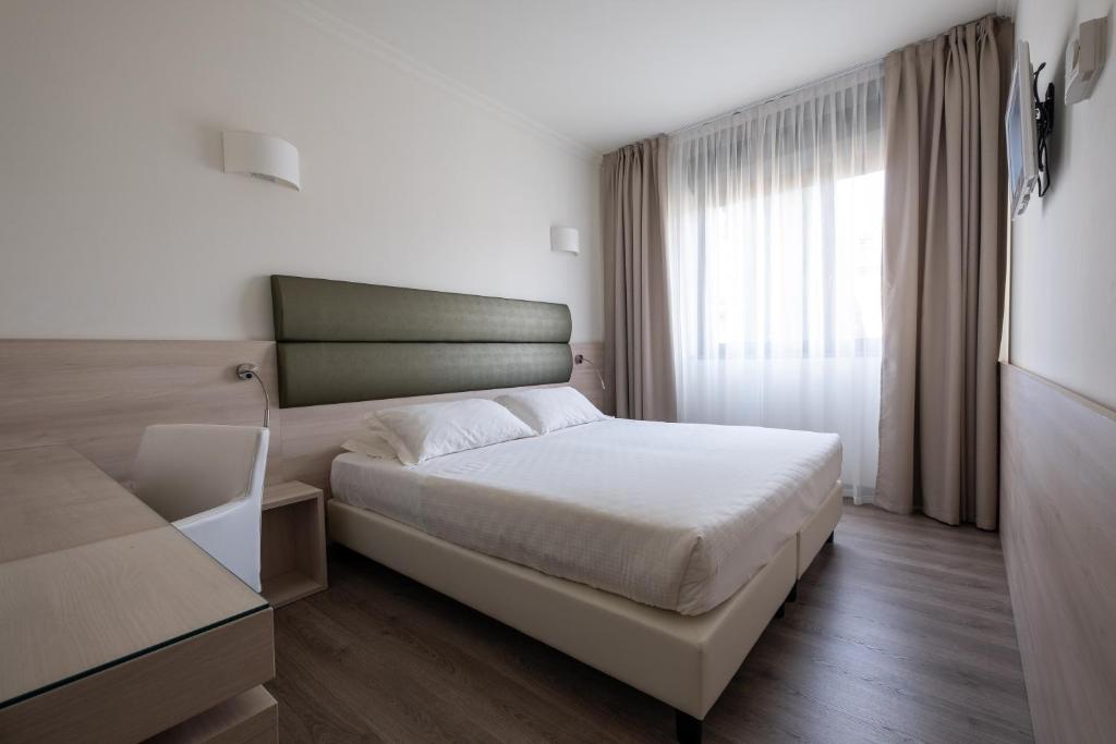 Postel nebo postele na pokoji v ubytování Hotel La Torretta