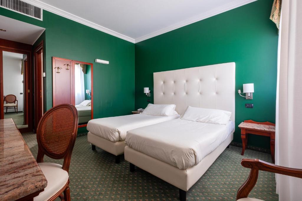 Postel nebo postele na pokoji v ubytování Hotel La Torretta
