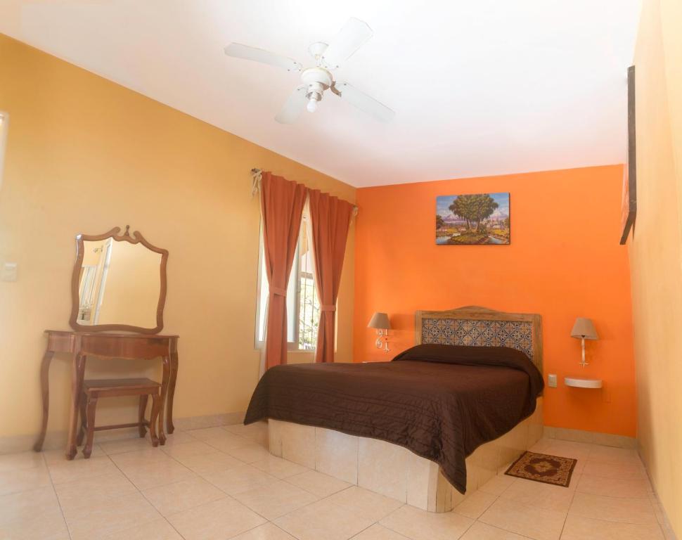 Postel nebo postele na pokoji v ubytování Hotel del Rio
