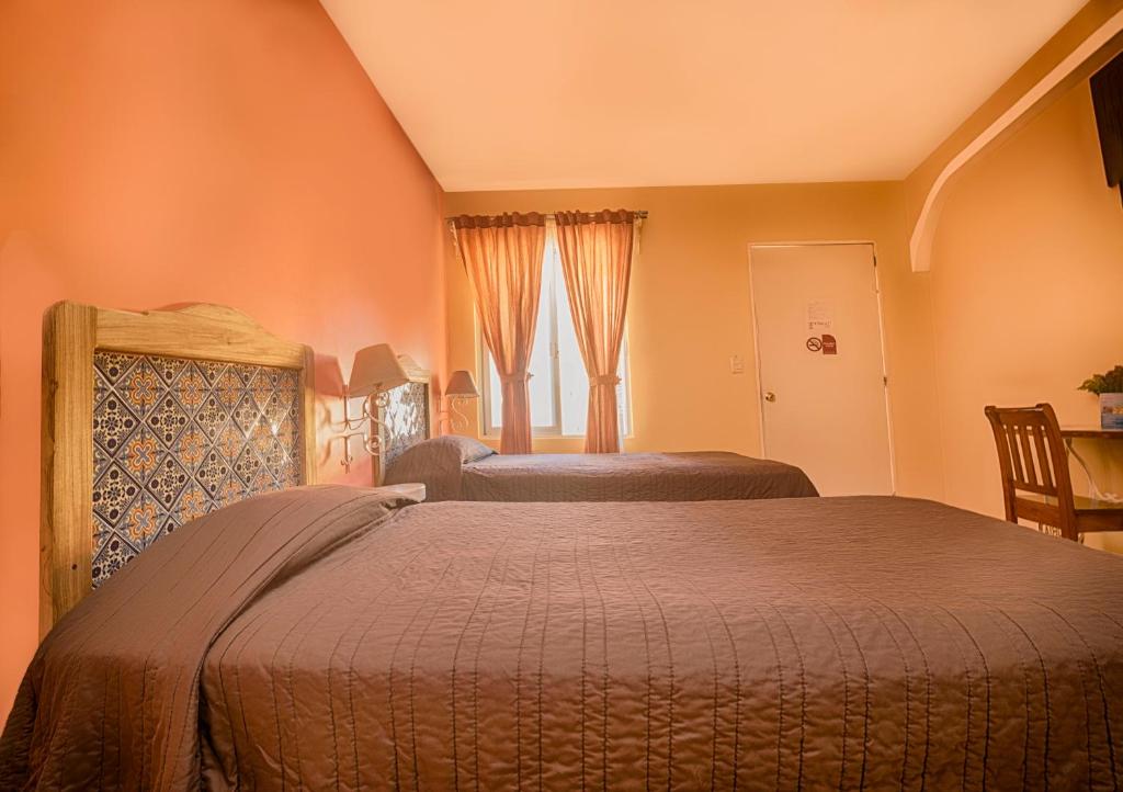Postel nebo postele na pokoji v ubytování Hotel del Rio