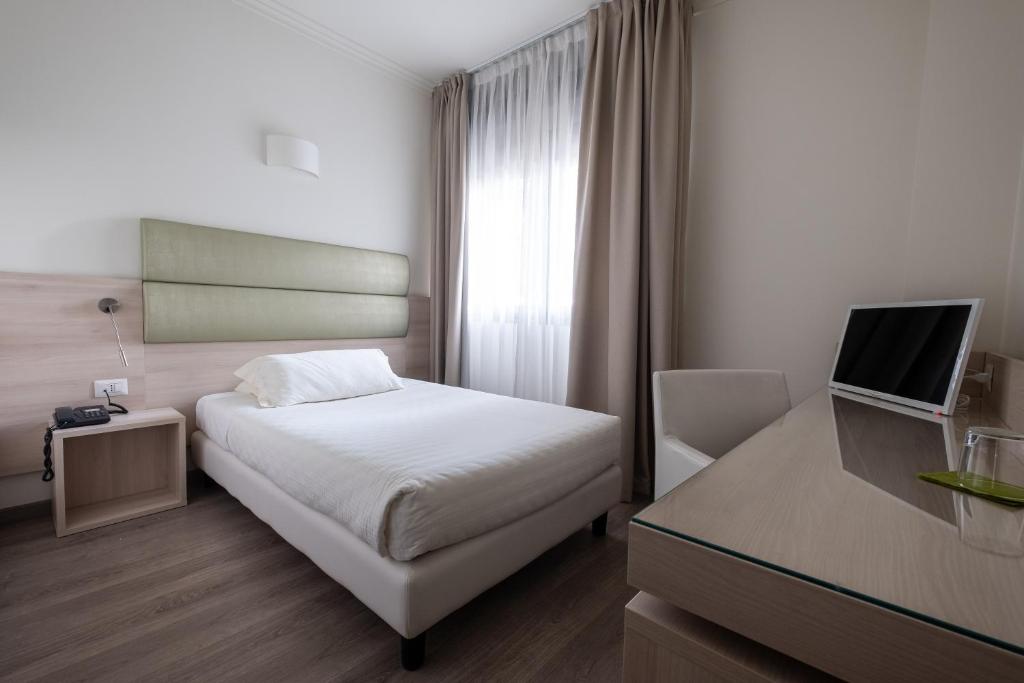 Postel nebo postele na pokoji v ubytování Hotel La Torretta