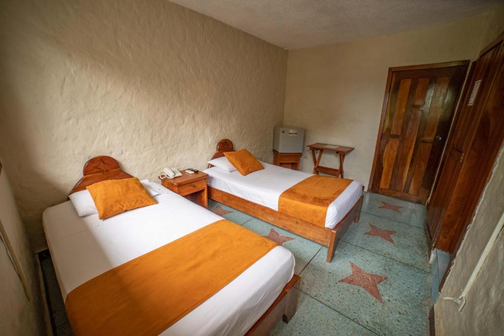 Postel nebo postele na pokoji v ubytování Hostal Estrella de Mar