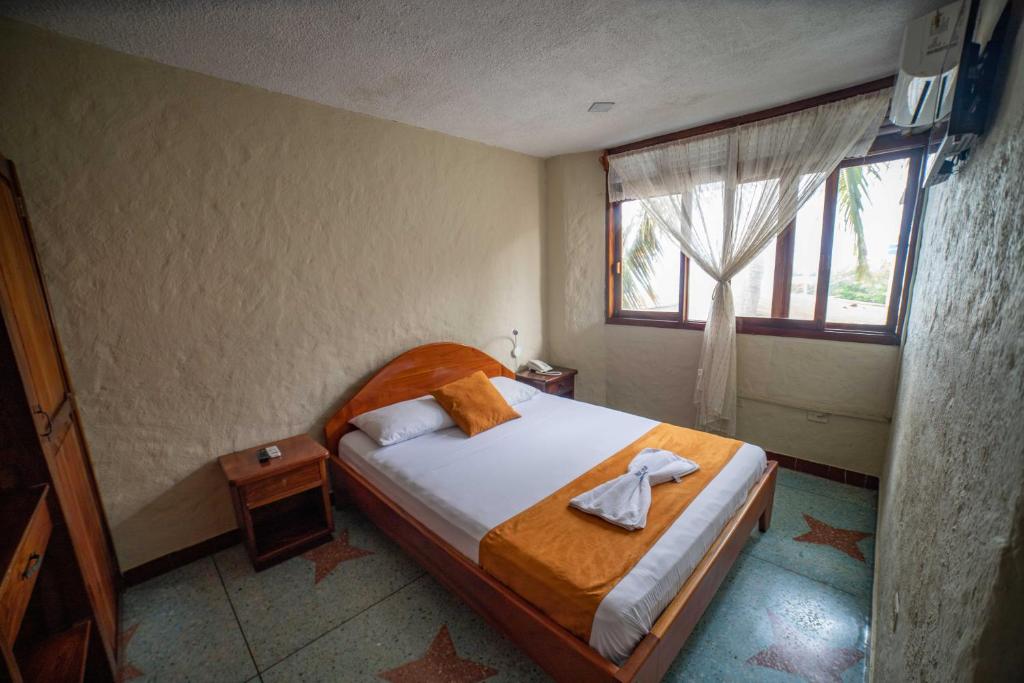 Postel nebo postele na pokoji v ubytování Hostal Estrella de Mar