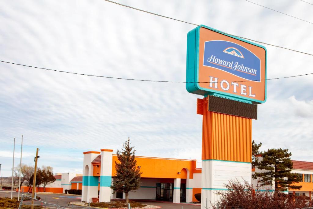 a hotel sign in front of a building at Howard Johnson by Wyndham Gallup in Gallup