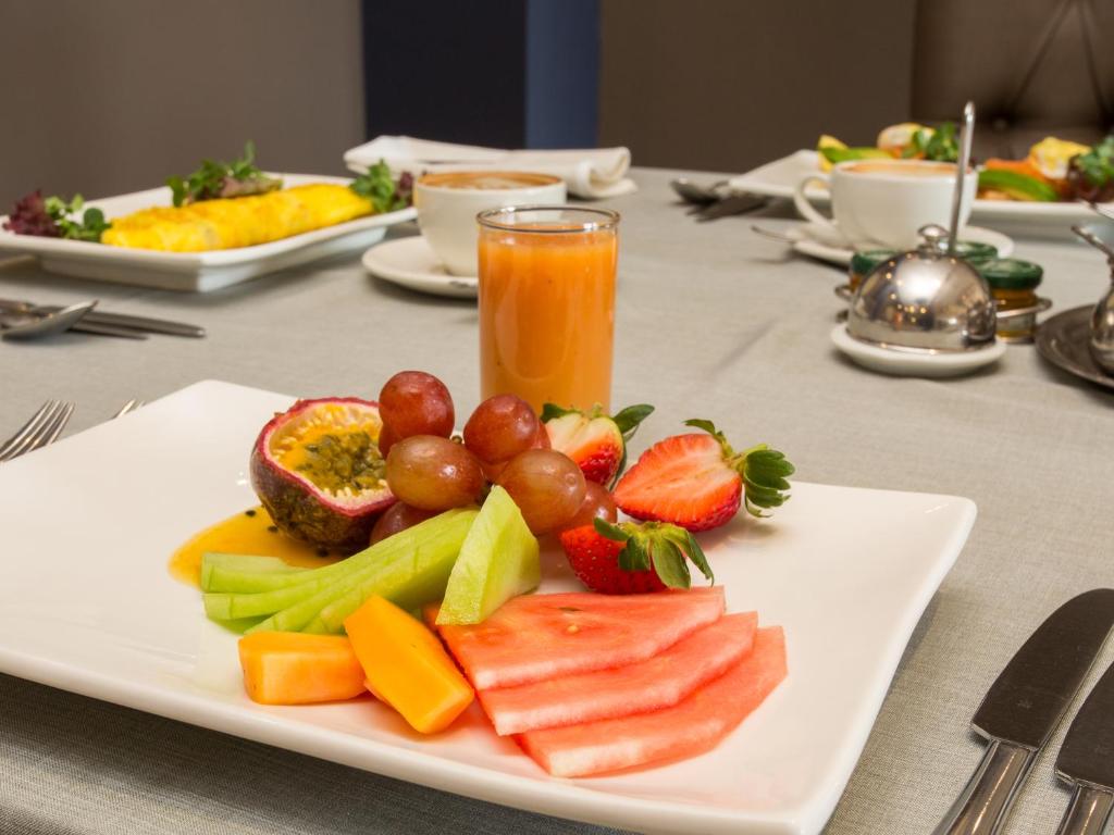 a plate of fruit and vegetables on a table at Shepherds Tree Game Reserve in Pilanesberg