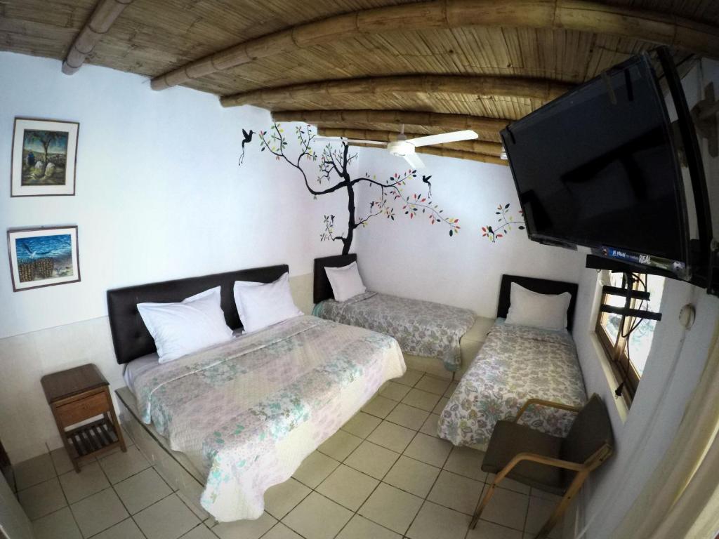 Postel nebo postele na pokoji v ubytování La Posada