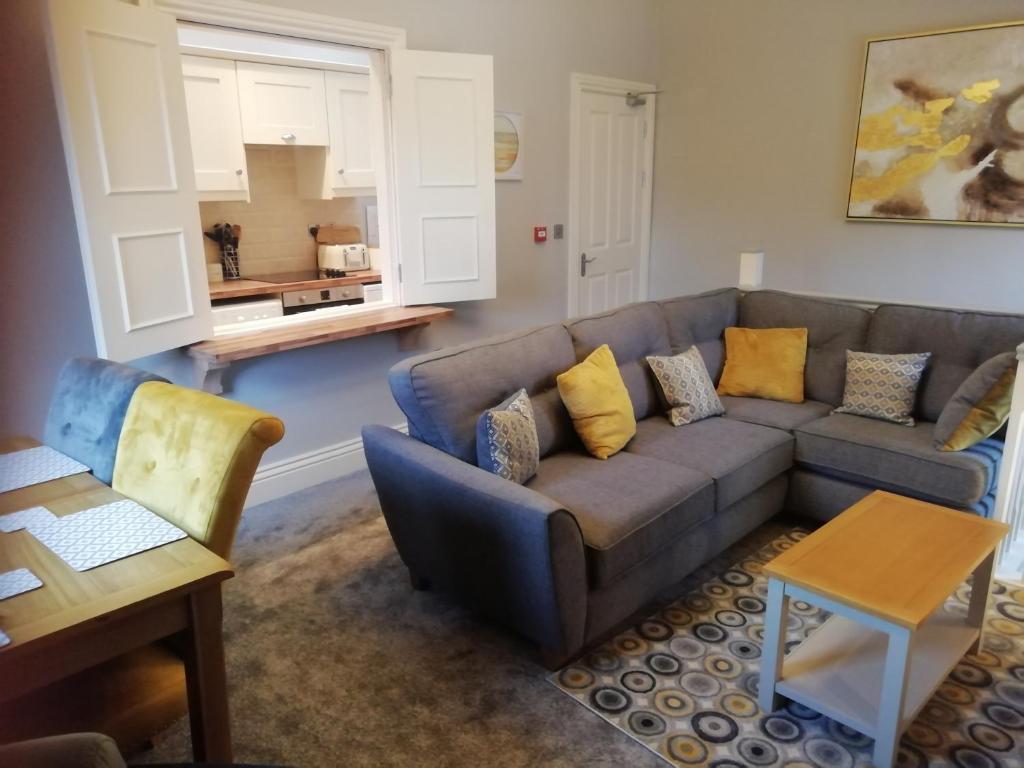 a living room with a couch and a table at Bolands Self Catering Accommodation in Hacketstown