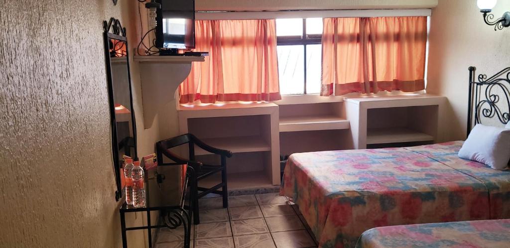 Postel nebo postele na pokoji v ubytování Hotel Terrasol
