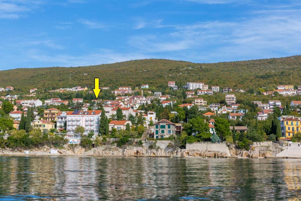 a town on the shore of a body of water at Apartments Petak Novi in Dramalj