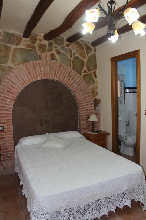 Postel nebo postele na pokoji v ubytování Casa Rural Laura