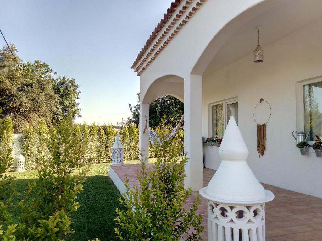 a home with a view of the yard at Laranjal Farm House - Casa da Lareira in Faro