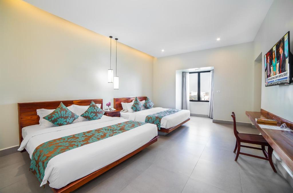 Postel nebo postele na pokoji v ubytování Bayon Modern Residence