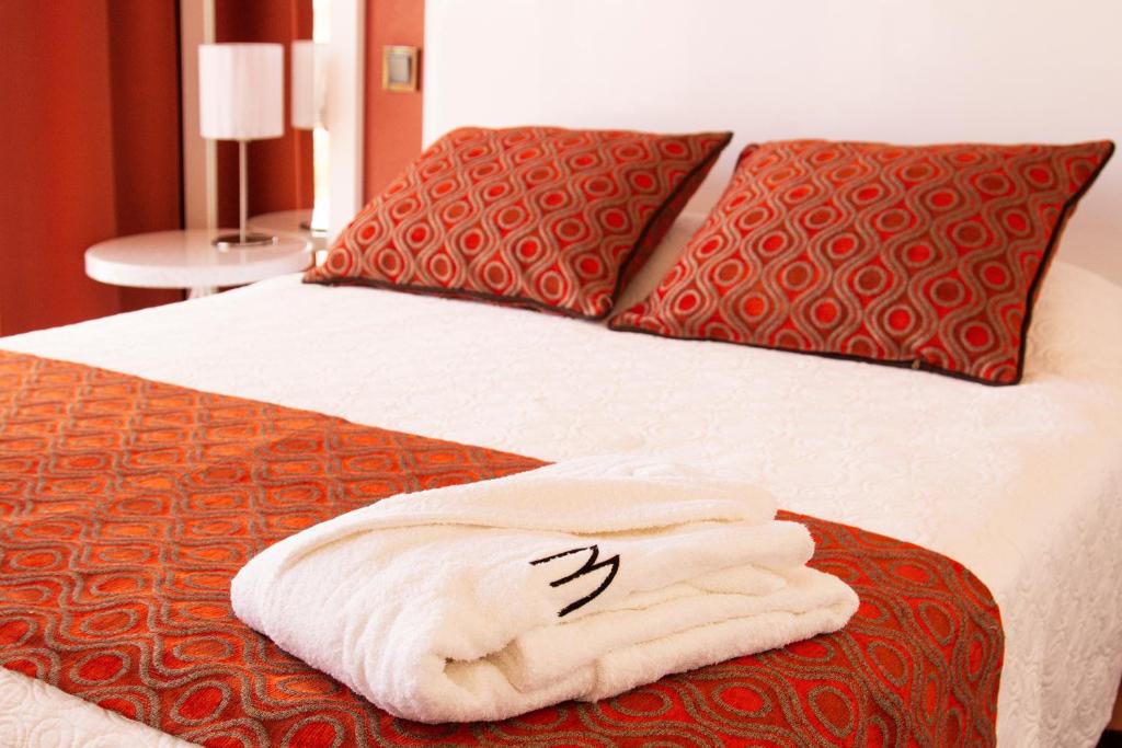 Een bed of bedden in een kamer bij Hotel Miramar Sul
