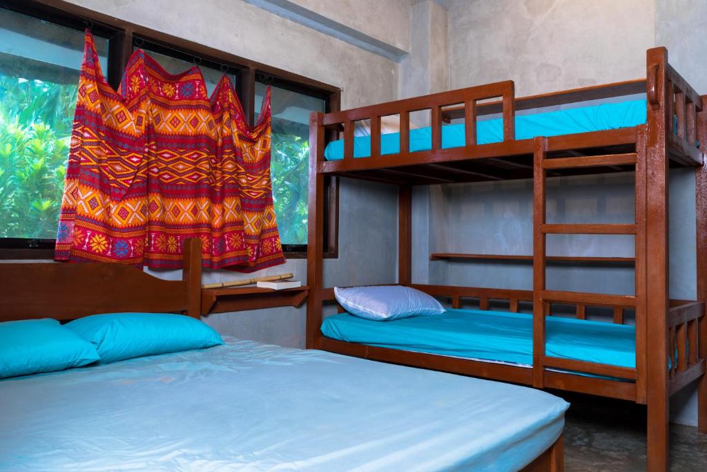 Voodi või voodid majutusasutuse Sinag Hostel toas
