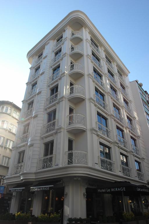 a large white building with balconies on it at Le Mirage Hotel in Istanbul
