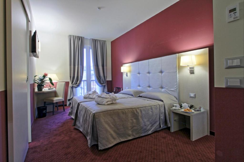 A bed or beds in a room at Boutique Hotel Calzavecchio