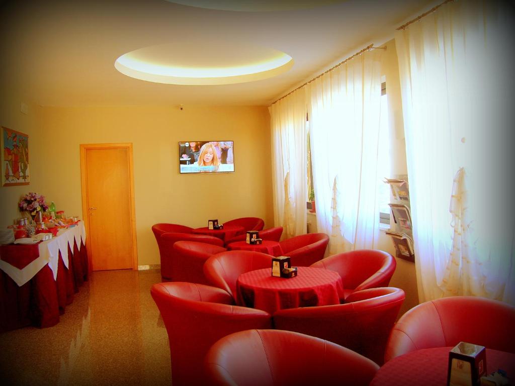 TV a/nebo společenská místnost v ubytování Hotel Genius