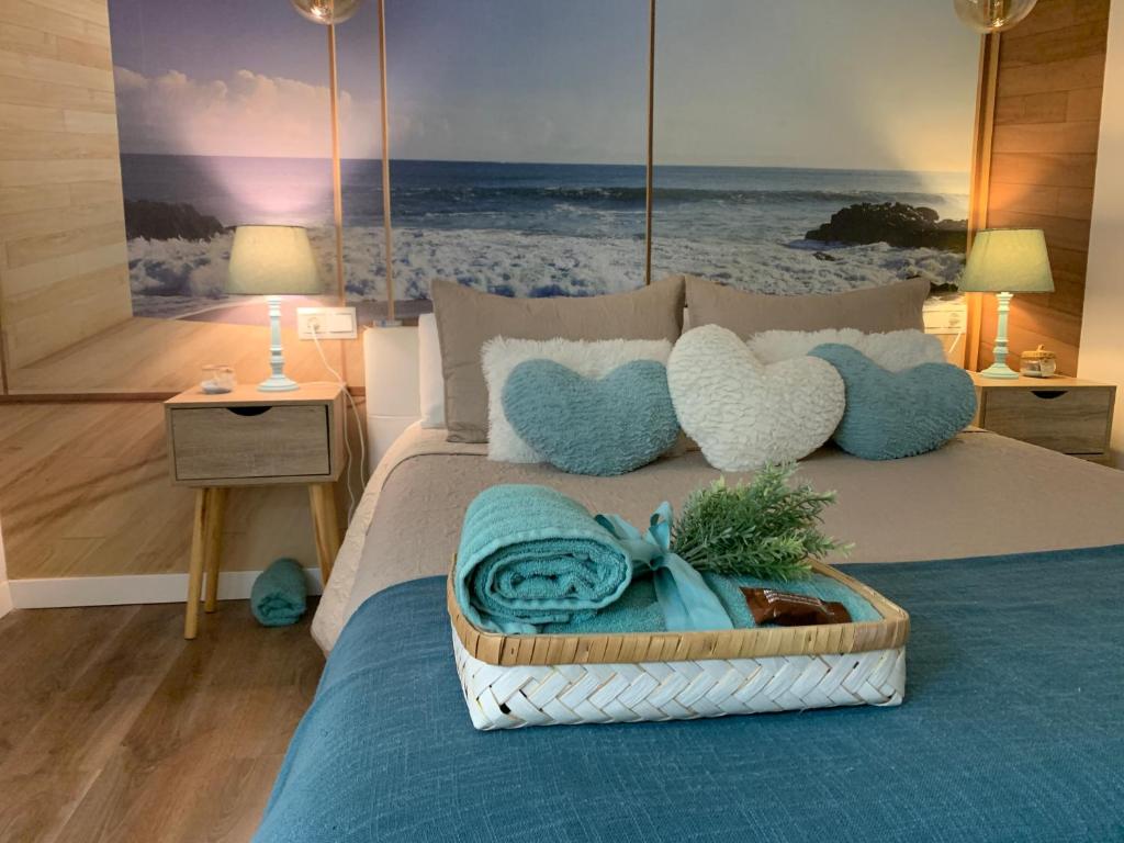 a bedroom with a bed with a tray of towels at Nuevo y Moderno Apartamento in Almería