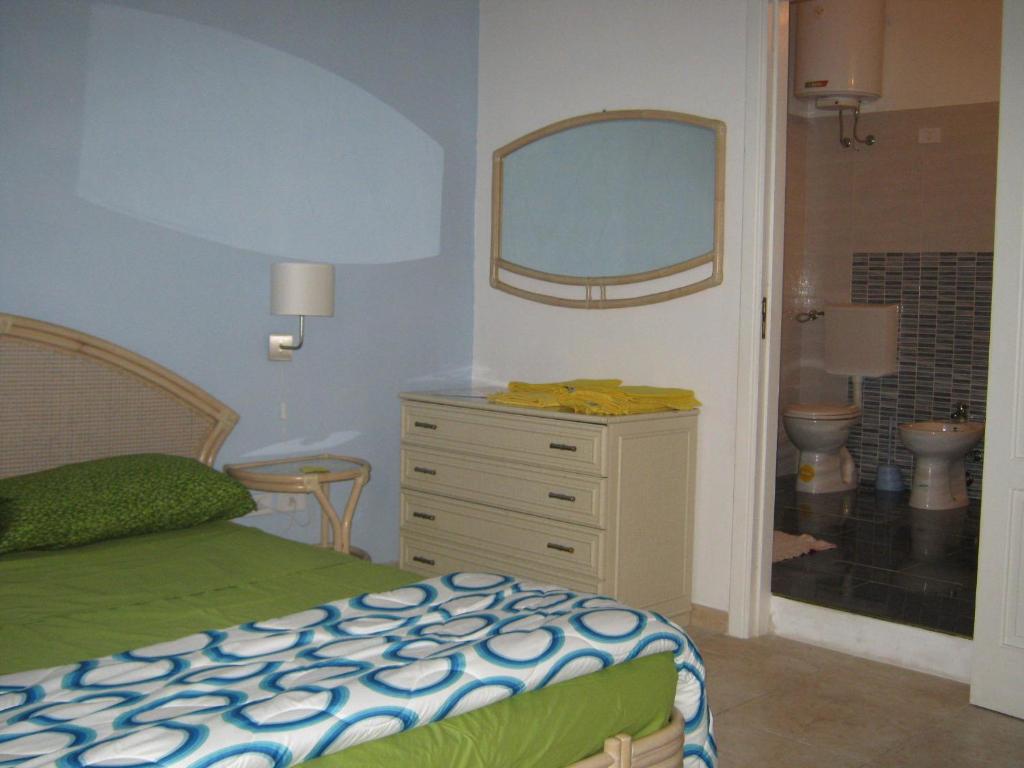 Postel nebo postele na pokoji v ubytování B&B Mare Di S. Lucia