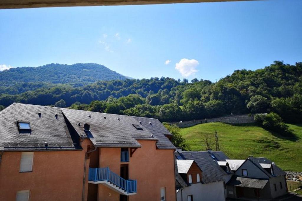 a group of houses with mountains in the background at appart luz in Luz-Saint-Sauveur