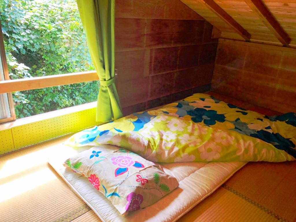 Voodi või voodid majutusasutuse 銀河荘-Galaxy Guesthouse 12歳以下不可 toas