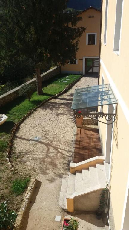 a glass table on the side of a building at Casa Vacanze La Villa in Morino