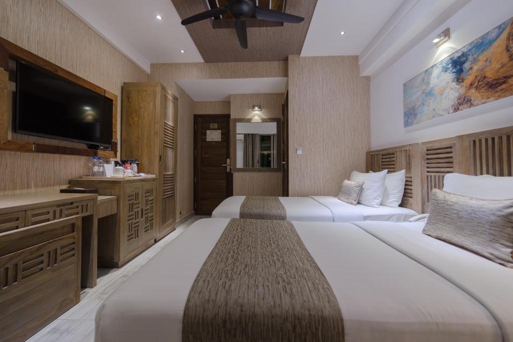 Postel nebo postele na pokoji v ubytování Hotel Ocean Grand at Hulhumale