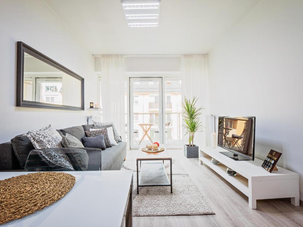 Posedenie v ubytovaní Apartamenty Homely Place Koziołki - Stary Rynek - Parking