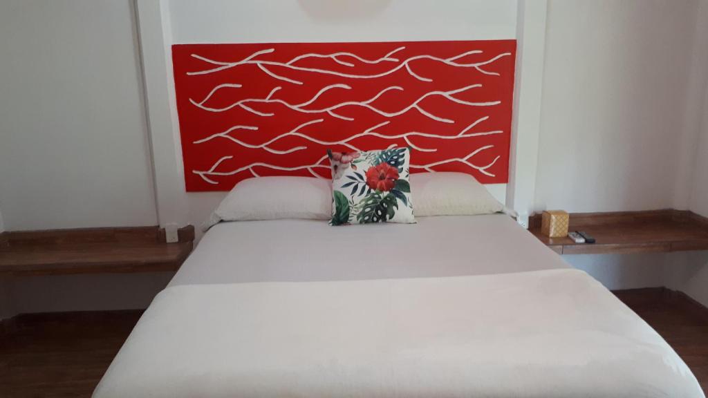 Postel nebo postele na pokoji v ubytování Tropical Paradise Bungalows
