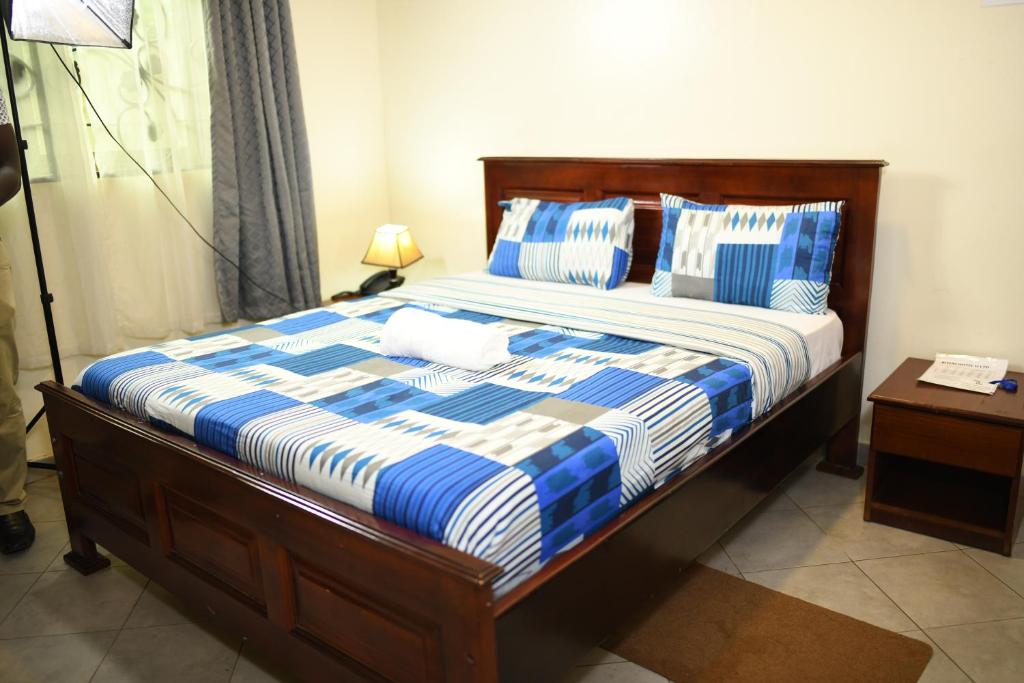 Postel nebo postele na pokoji v ubytování Biyem Hotel